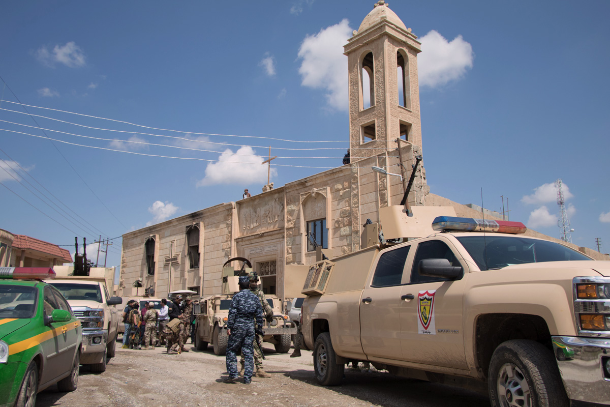 Image Christians in Bartella Iraq celebrate Easter surrounded by military protection